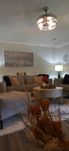 a living room with a couch and a table at Stay at The Retreat! Gatlinburg-Dollywood in Sevierville