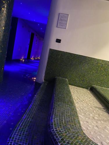 Ένα ή περισσότερα κρεβάτια σε δωμάτιο στο Grand Hotel Miramonti