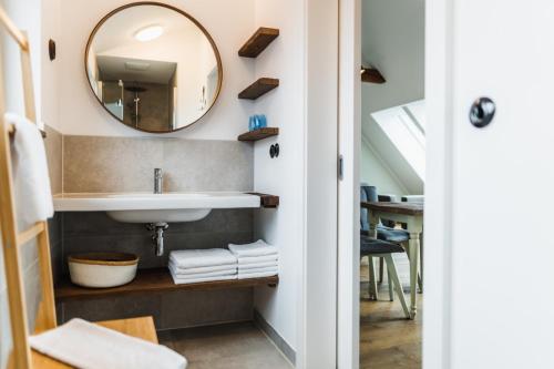 a bathroom with a sink and a mirror at Weingut Kögl in Ratsch an der Weinstraße