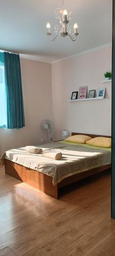 Ένα ή περισσότερα κρεβάτια σε δωμάτιο στο VIP Apartments in the Centre