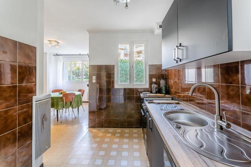 a kitchen with a sink and a counter top at Le Marignan- Studio plein centre in Cassis