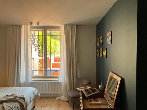 Postel nebo postele na pokoji v ubytování Maison Henri Namur