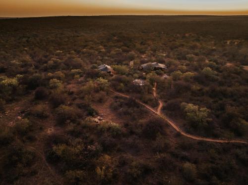 an overhead view of a forest with houses and trees at Oase by 7 Star Lodges - Greater Kruger Private 530ha Reserve in Hoedspruit