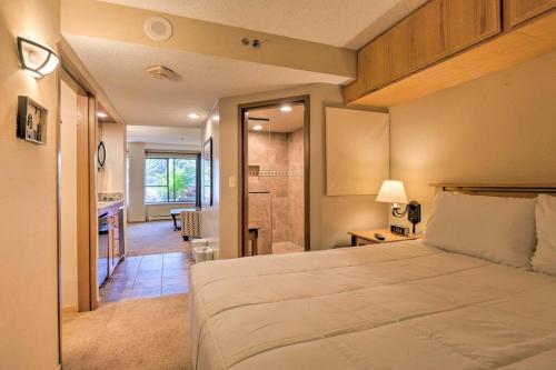 a bedroom with a large bed and a bathroom at Beaver Run Resort Studio in Breckenridge