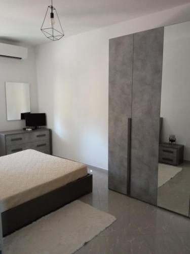 Ένα ή περισσότερα κρεβάτια σε δωμάτιο στο A Casa di Gi