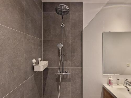 a bathroom with a shower and a sink at Appart-Hotel Léopold Liège Centre in Liège