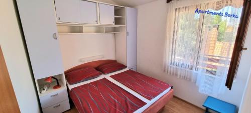 Posteľ alebo postele v izbe v ubytovaní Apartments Borka