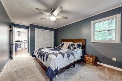 a bedroom with a bed and a ceiling fan at Apres Chalet in Carroll