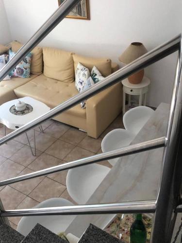 a living room with a couch and a table at Apartment Bonaca in Komarna
