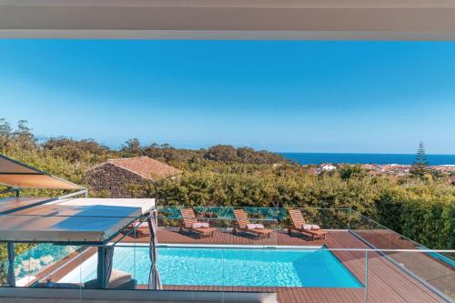 a view of a swimming pool from a house at Quinta do Charco in Ribeira Grande