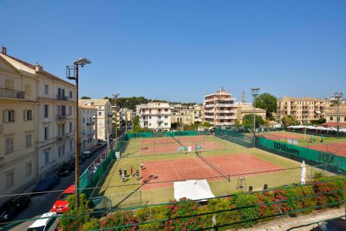 a tennis court in the middle of a city at History House in Corfu Town