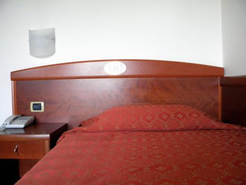 Кровать или кровати в номере Hotel Corone
