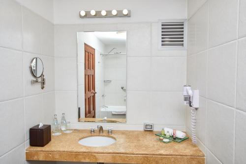 a bathroom with a sink and a mirror at Casa Andina Premium Arequipa in Arequipa