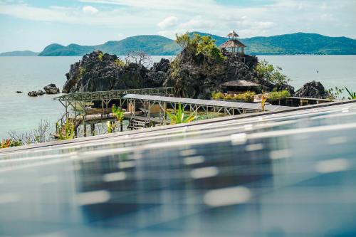 a view of the ocean from a swimming pool at Sangat Island Dive Resort in Coron