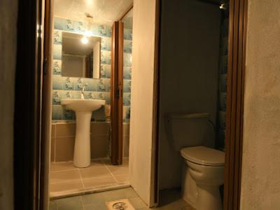 a bathroom with a sink and a toilet at St.Jadoor Inn in Al Azraq ash Shamālī