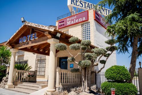 a hotel with a sign that reads hotel malaga at Hotel Malena in Caravaca de la Cruz