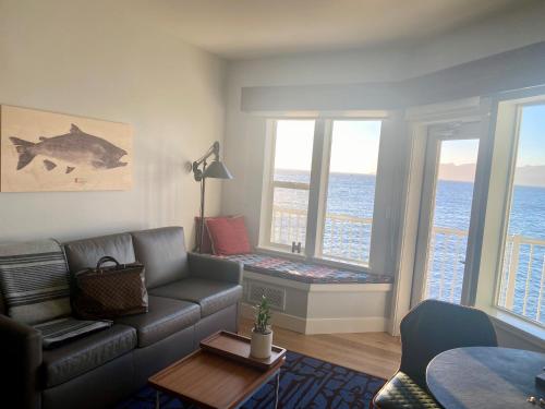 a living room with a couch and a table at Cannery Pier Hotel & Spa in Astoria, Oregon