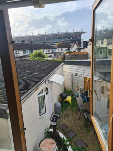 a view from the window of a balcony with a view of a ballpark at osullivans ave in Dublin