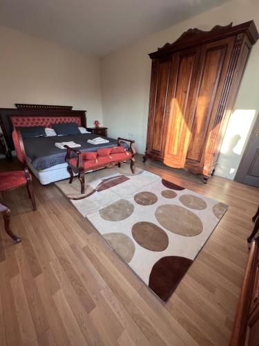 a bedroom with a bed and a rug on the floor at Dalv Residence - SPA Fairy Tale in old Sofia in Sofia