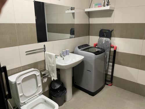 a bathroom with a sink and a toilet at Tenexia - La Gaulette Studio in La Gaulette