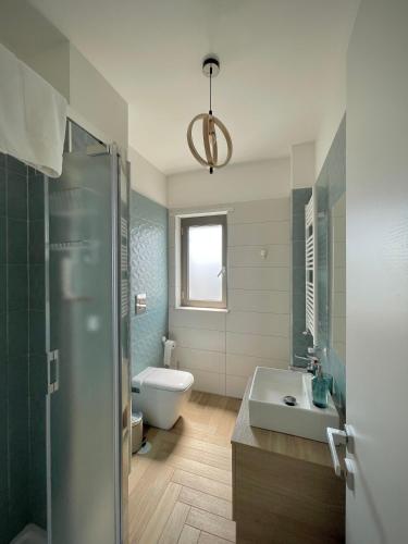 a bathroom with a shower and a sink and a toilet at Orti di Serapo -VERDE in Gaeta