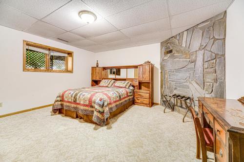 a bedroom with a bed and a desk at Crooked Canyon Lodge in Rapid City