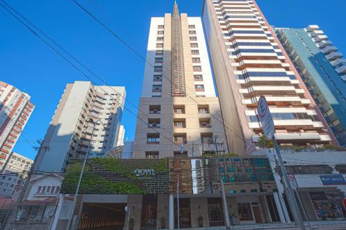 a group of tall buildings in a city at QOYA Hotel Curitiba, Curio Collection by Hilton in Curitiba