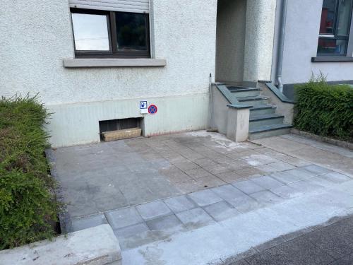 a building with a parking meter in front of it at Nice rooms in Beggen house - In Luxembourg city in Luxembourg