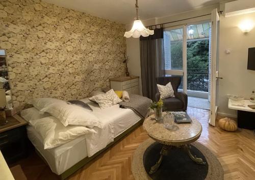 a living room with a couch and a table at Apartment Navigator's lodging in Kotor
