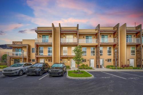 a building with cars parked in a parking lot at Luxury Villa Less Than A Mile From Disneyworld -Bonus Elevator- in Orlando