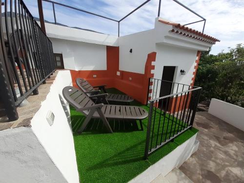 a model of a house with chairs and grass at Vv Puerto del Trigo - Stella in Alojera