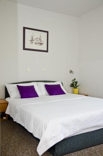 Ένα ή περισσότερα κρεβάτια σε δωμάτιο στο Hotel Fala Zagreb