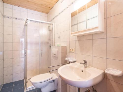 a bathroom with a sink and a toilet and a shower at Haus Rieder in Gerlosberg