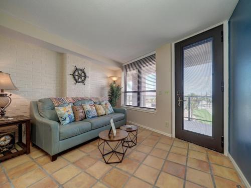 a living room with a couch and a window at Costa Crinks at Aransas Princess in Port Aransas