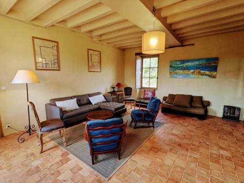 a living room with a couch and chairs at Ferme restaurée près Zoo de La Flèche, 200m², 8 pers, terrasse, nature et repos - FR-1-410-230 in Bazouges-sur-le-Loir