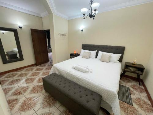 Ένα ή περισσότερα κρεβάτια σε δωμάτιο στο Real Marquez Hotel