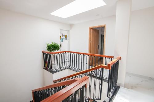 a staircase in a house with a plant on it at The View Hotel in Cam Lâm