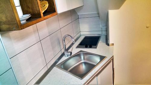 a stainless steel sink in a small kitchen at Studio Laura in Split