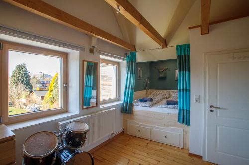 a bedroom with a bed and a large window at Zuhause im Paradies in Hannover