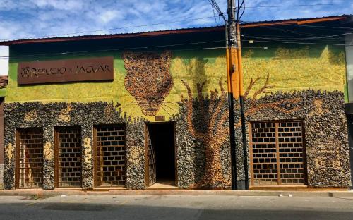 a building with a mural of a bear on it at Refugio del Jaguar in Medellín