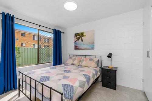 a bedroom with a bed and a window at Iluka Villa 4 in Iluka