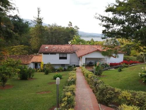a view of the house from the garden at casa calima in Calima