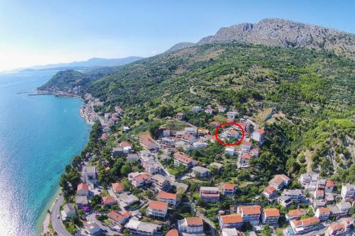 an aerial view of a town next to the ocean at Apartments with a parking space Krilo Jesenice, Omis - 15928 in Krilo