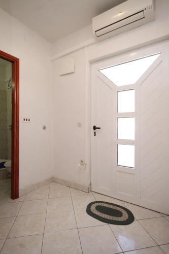 a room with a white door with a window at Apartments by the sea Rukavac, Vis - 2478 in Rukavac