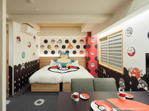 a childs bedroom with a bed with a hello kitty wall at MIMARU OSAKA NAMBA North in Osaka