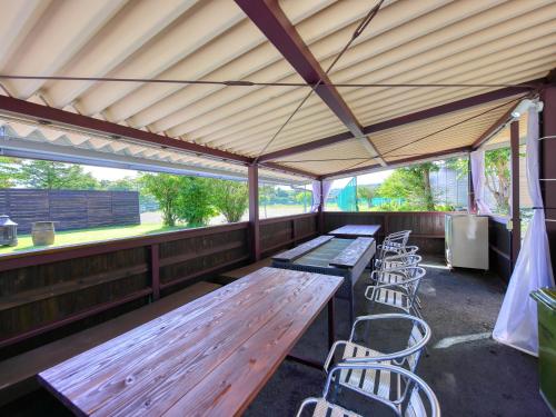 a group of picnic tables and chairs in a pavilion at SILVER SPRAY MtFuji view Yamanakako in Yamanakako