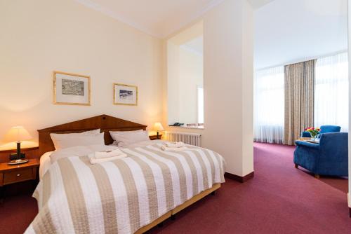Ένα ή περισσότερα κρεβάτια σε δωμάτιο στο Aparthotel Seeschlösschen