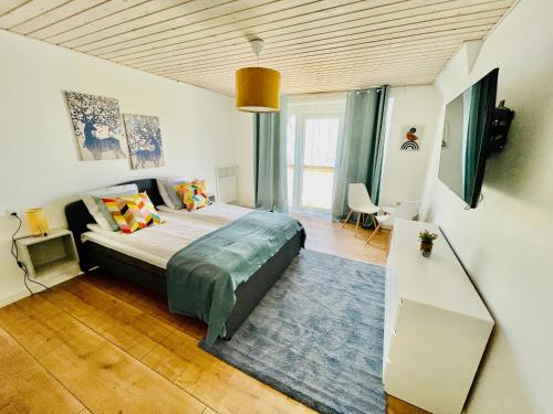 a bedroom with a large bed in a room at aday - Frederikshavn City Center - Charming double room in Frederikshavn