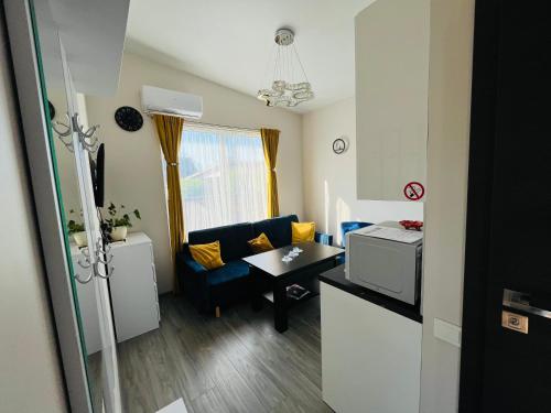 a small living room with a couch and a table at Royal Resident in Druskininkai