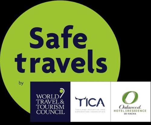 a sign with the words safe travels and a world tourism council at Oakwood Hotel & Residence Sri Racha in Si Racha